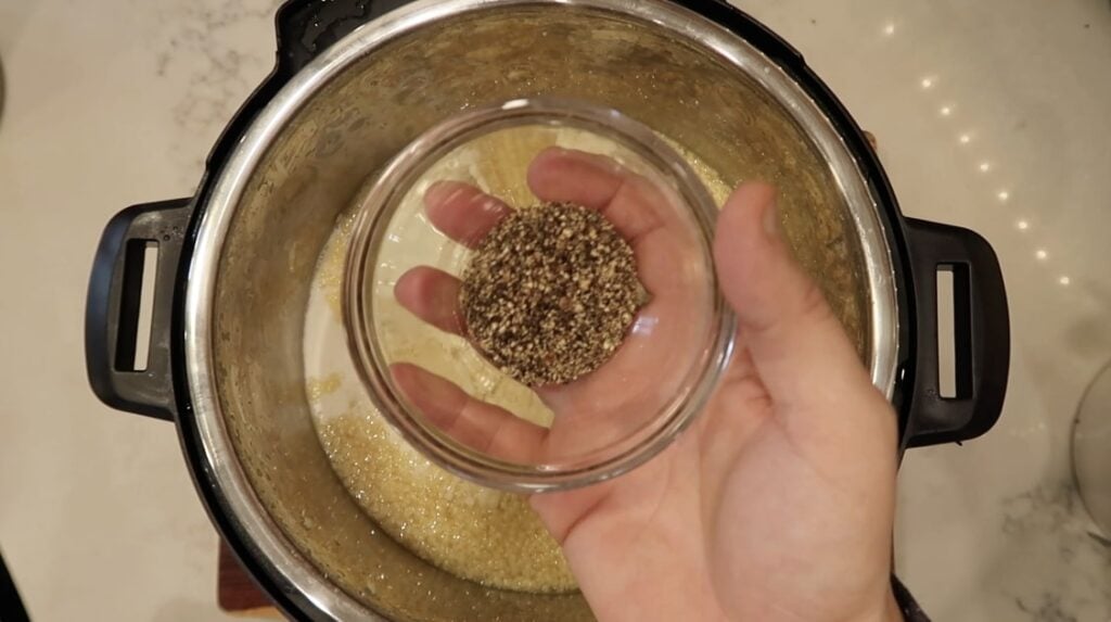 Adding pepper to pastina